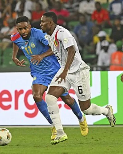 Cédric Bakambu — Amadou Diawara of Guinea is challenged by Cedric Bakambu of DR Congo during the 2023 Africa Cup of Nations quarterfinal match between DR C